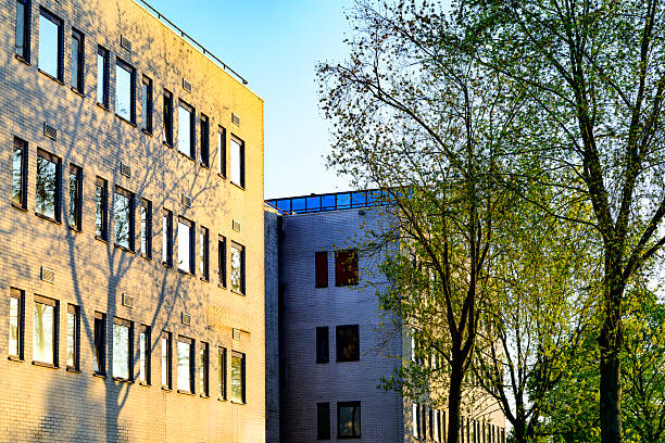 Office building with green natural surroundings in the office district of Zwolle during a springtime day.