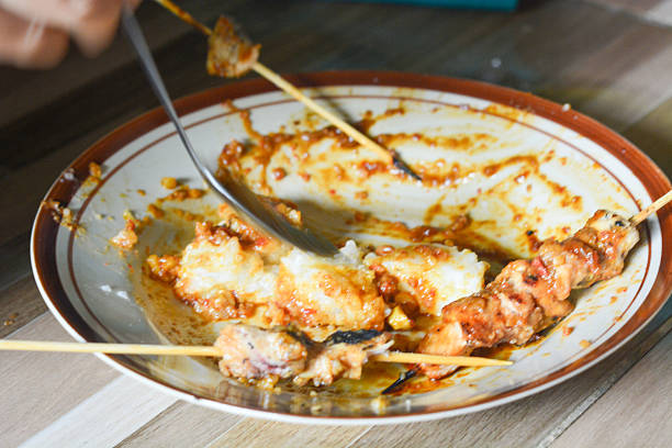 Family meal celebration with spicy peanut sauce satay menu