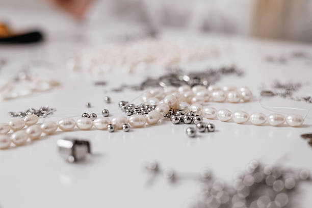 istock Jewelry Making Supplies with Pearls, Beads, and Tools close up 2212059004
