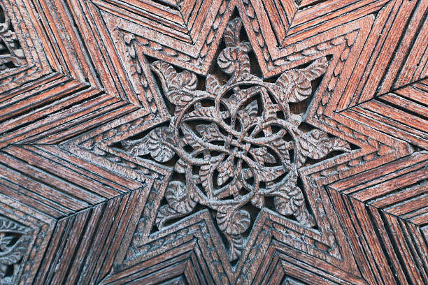 istock Old wooden tile detail Moroccan style pattern abstract texture in a building in Fez, Morocco 2212060433