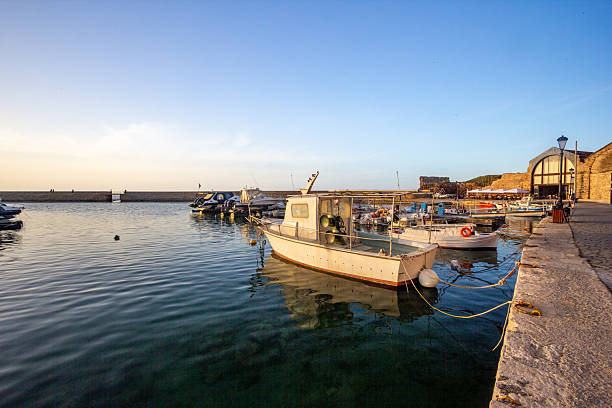 The docks of Chania, located in the Old Venetian Harbor on Crete’s northwest coast, were originally constructed by the Venetians between 1320 and 1356. Designed for both commercial and military use, the harbor includes shipyards known as \
