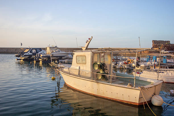 The docks of Chania, located in the Old Venetian Harbor on Crete’s northwest coast, were originally constructed by the Venetians between 1320 and 1356. Designed for both commercial and military use, the harbor includes shipyards known as \