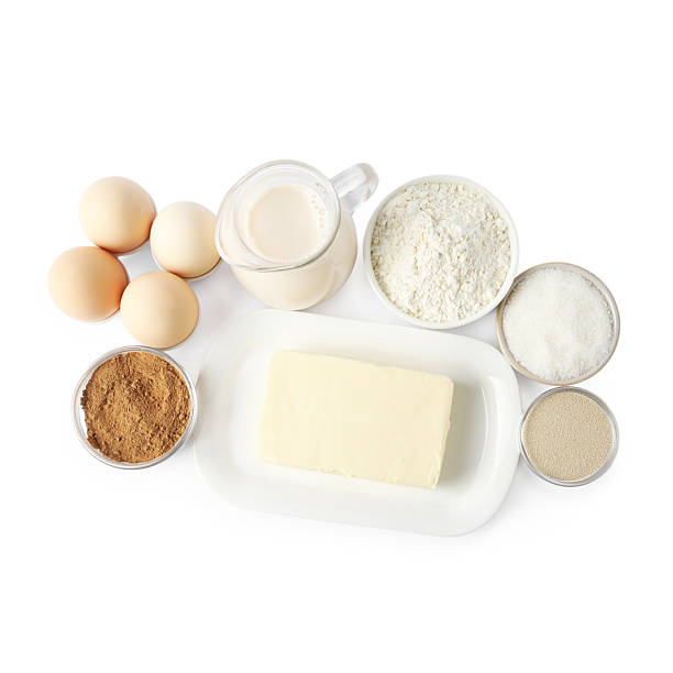 istock Making cinnamon rolls. Different ingredients for dough isolated on white, top view 2212061947