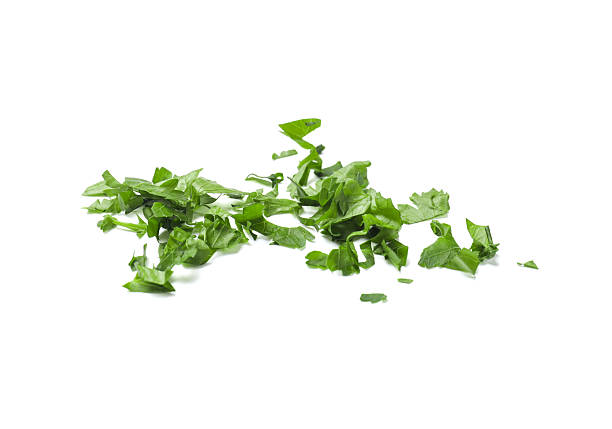 Chopped green parsley leaves isolated on white