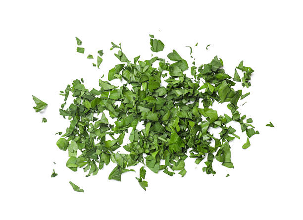 istock Chopped green parsley leaves isolated on white 2212062876