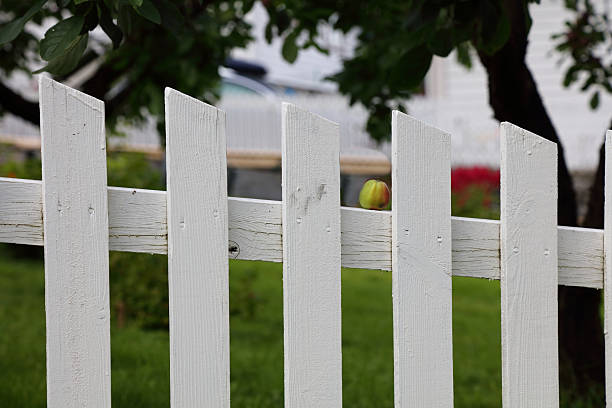 A fence that looks like tiny little houses