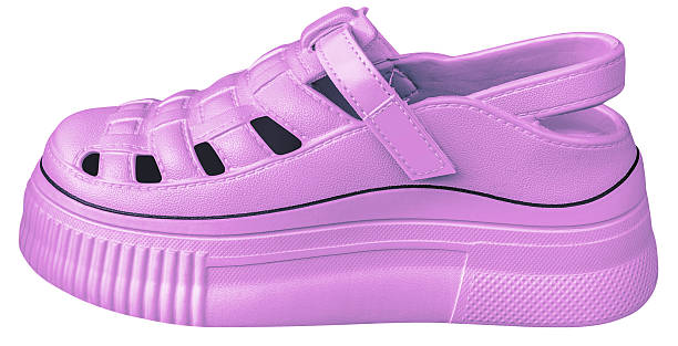 The girl's dirty pink slippers on a white background