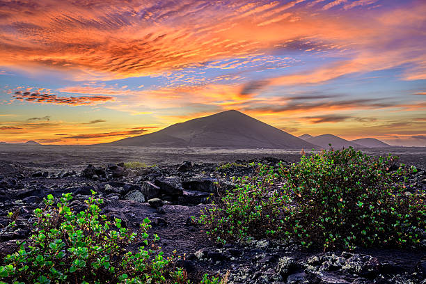 istock Beautiful sunset over volcano on Lanzarote island 2212067515