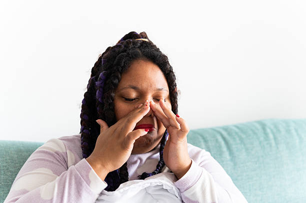 istock Woman applying nasal strips at home for better breathing 2212068261