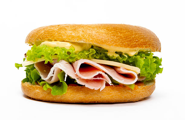 istock ham, cheese, and salad bagel sandwich - studio photography 2212069196