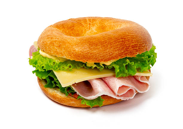 istock ham, cheese, and salad bagel sandwich - studio photography 2212069204