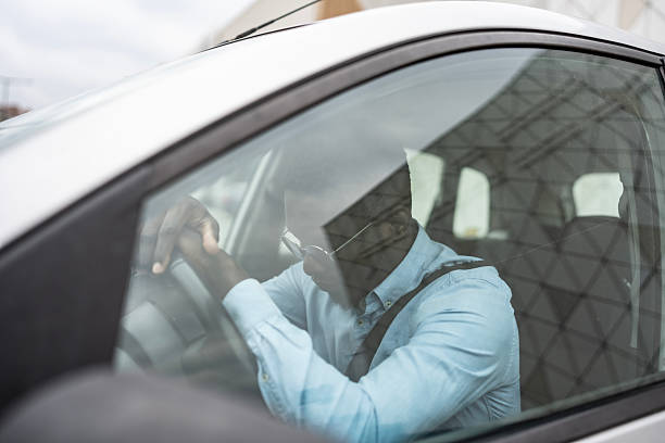 Frustrated Individual Resting Inside a Car During Daytime