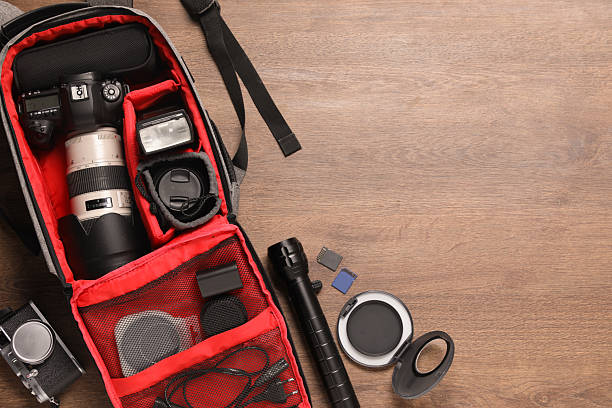 istock Photographer's equipment on wooden background, flat lay. Space for text 2212070984