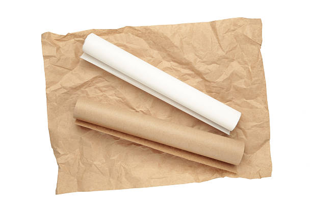 istock Rolls of white and brown baking paper isolated on white background 2212071388