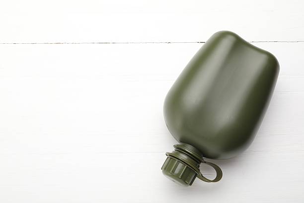 Army green stainless steel water bottle isolated on white background. Camping Tumbler. White reusable water bottle mockup.