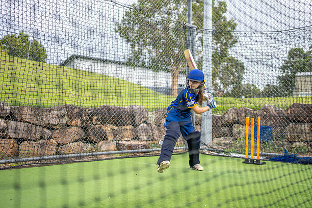 istock Girl Hitting Shot During Cricket Net Session 2212071854