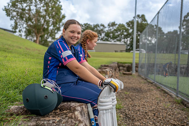 istock Girls Resting at Cricket Practice 2212071895