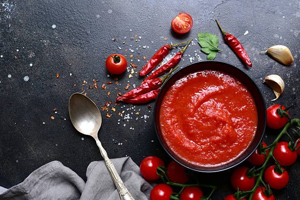 istock Homemade spicy tomato sauce with ingredients for making. Top view with copy space. 2212073334