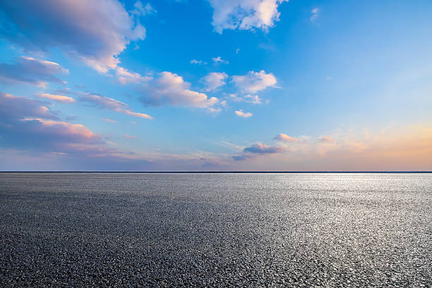 istock Asphalt road and beautiful sky clouds at sunset 2212073778