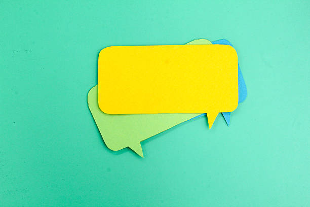 istock two examples of green and yellow conversation columns. Comic speech balloon. paper speech bubble. conversation concept 2212075147