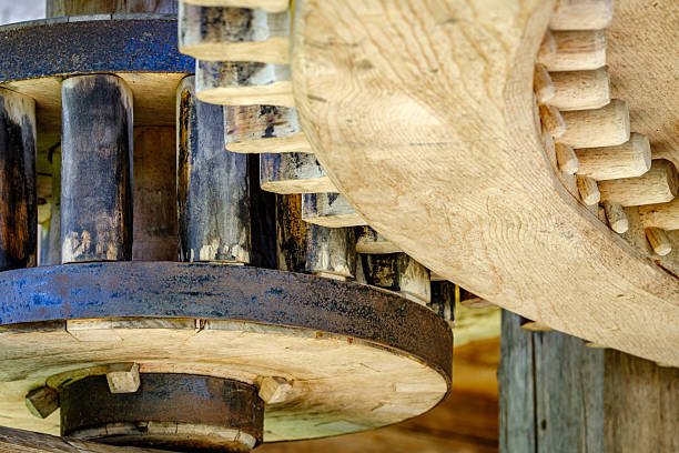 istock Detailed view of interlocking gears working together in a mechanical system during daylight 2212077427