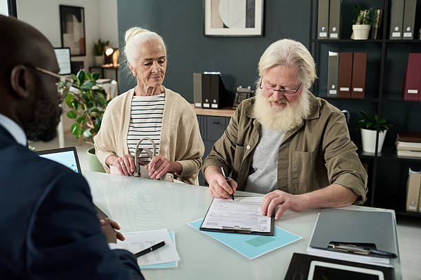 istock Senior Man Signing Contract In Office 2212080457