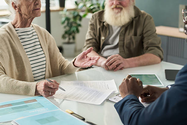 istock Senior People Signing Contract In Office 2212080539