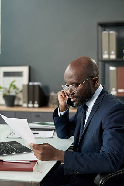 istock Businessman Talking On The Phone In Office 2212080608