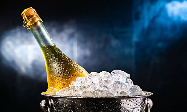 istock Bottle of sparkiling wine in bucket with crushed ice. 2212084594