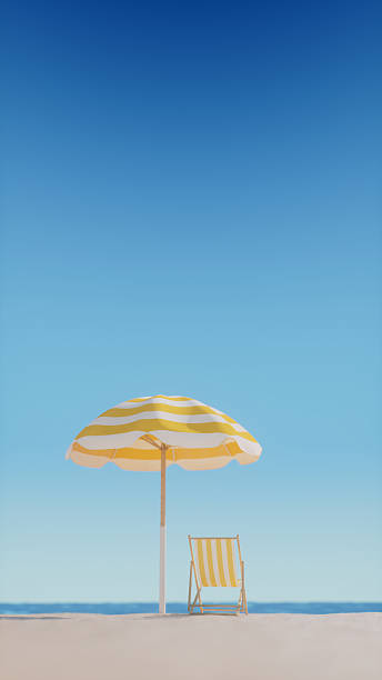 istock Empty deck chair and beach umbrella on a sunny beach 2212090390