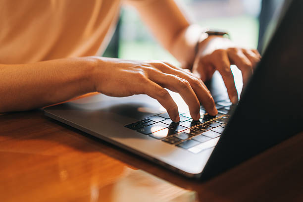 istock Casual professional working remotely on laptop indoors with natural light 2212091553