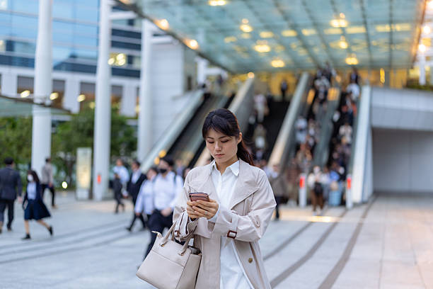 istock Businesswoman going back home after work, using smart phone 2212092883