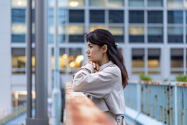 istock Businesswoman looking at view from footbridge 2212092919
