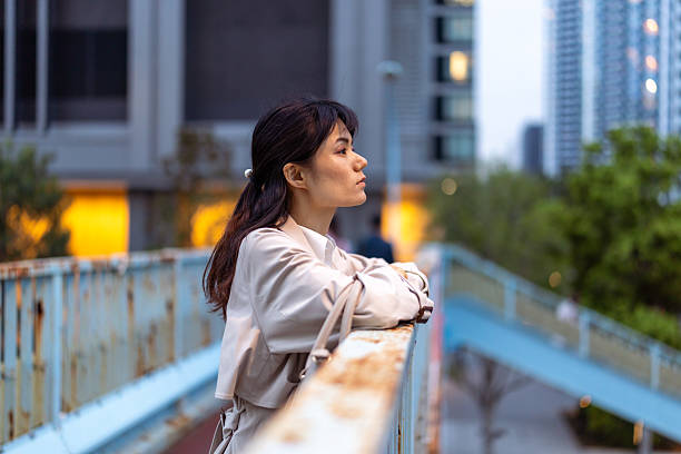 istock Businesswoman looking at view from footbridge 2212093073