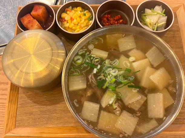 istock A bowl of Korean beef soup and side dishes 2212093892