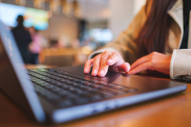 istock Closeup image of a woman hands working and touching on laptop computer touchpad 2212099330