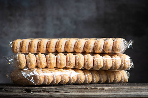 Italian sponge fingers. Sweet biscuit in packaging o black background