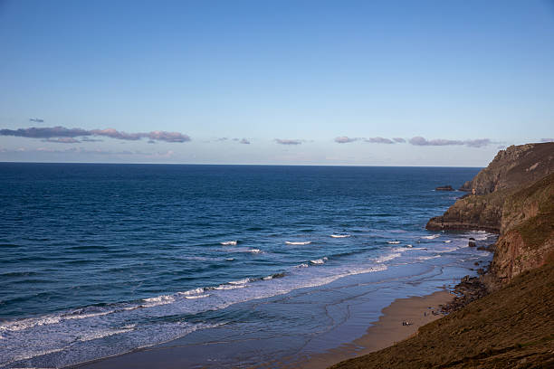 Aerial view of calm bay and resort town in morning light