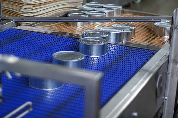 istock Some aluminum cans are moving along a conveyor belt 2212115376