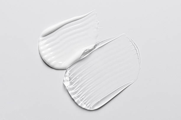 istock A sample of white and transparent cosmetic cream 2212118090