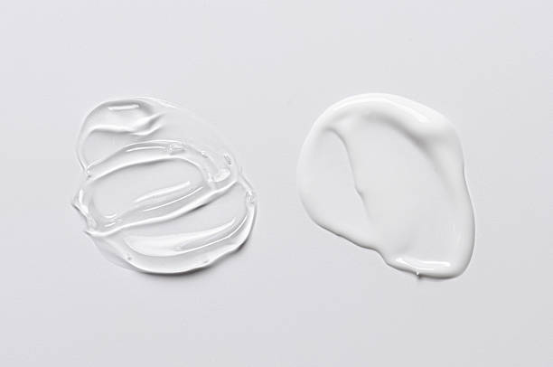 istock A sample of white and transparent cosmetic cream 2212118092