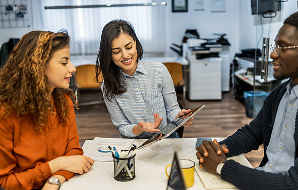 istock Business team meeting: discussing strategy with tablet 2212119463