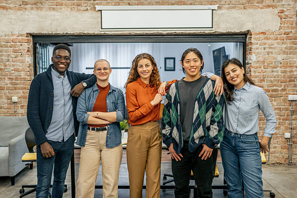 istock Startup team smiling at camera in modern office 2212119609