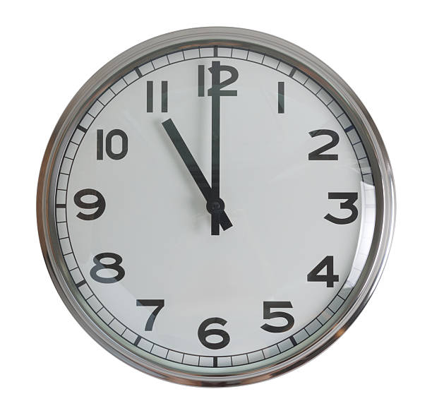 istock Wall hanging analog clock with white face and black number in classic vintage design 2212120243