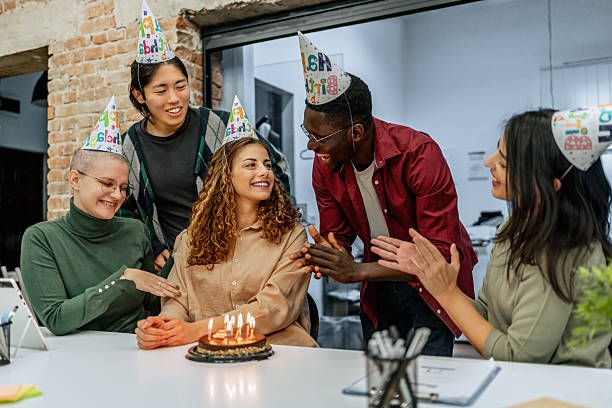 istock Colleagues celebrating birthday in the office 2212120487
