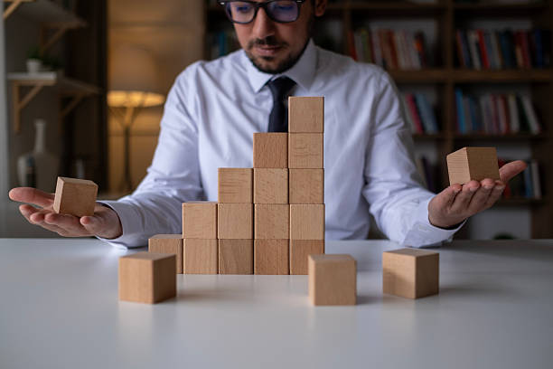 istock Hand arranging wood cube stacking as step stair. Business concept growth success process. 2212124489