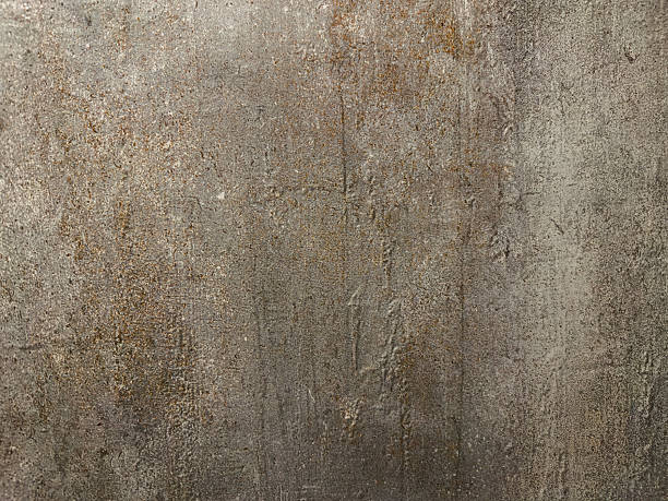 istock An aged plaster surface shows vertical streaks and a mottled appearance with subtle color variations, suggesting age and weathering, providing a textured backdrop 2212125610
