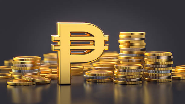 istock Peso Symbol with Stacked Coins on Dark Background 2212127328