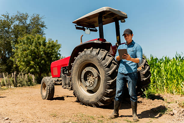 istock Mid adult farmer man using digital tablet at agricultural field 2212132028