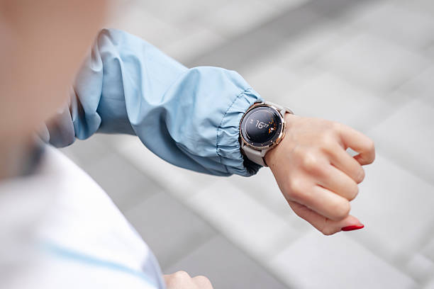 istock Woman checking time on her smartwatch during workout 2212135351